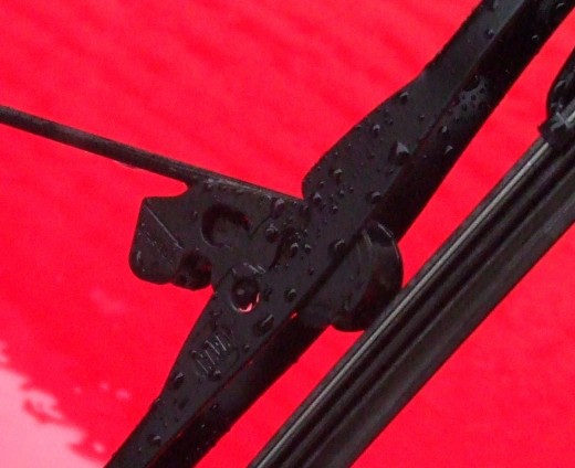 Close-up of windshield wiper and attachment point. Close-up of windshield wiper and attachment point.