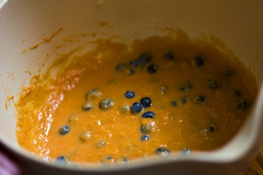 Mix the bright blueberries into the orange pumpkin batter. The colors of this recipe are so fun!