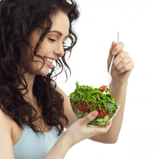 Beautiful woman eating healthy