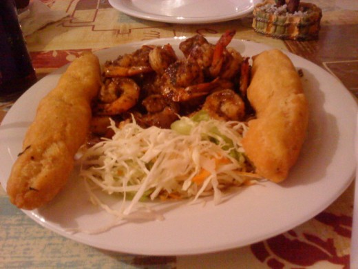 A delectable honey-roasted shrimp and festival dish, Port Royal-Jamaica
