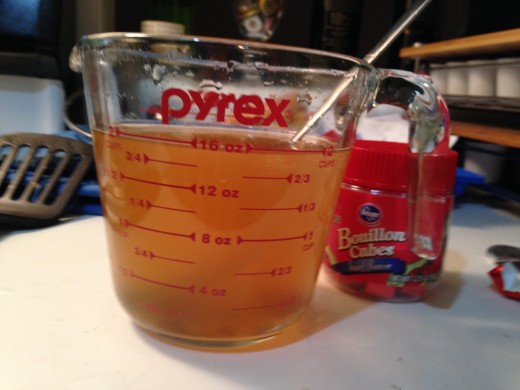 Two beef bouillon cubes dissolved in water.