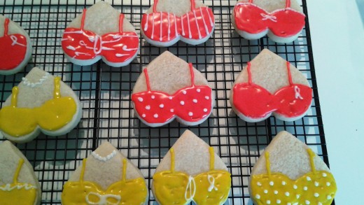 Make sure frosting is completely dry before you store them. I like to dry them on cooling racks.