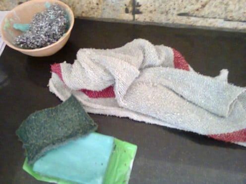wet cloth, steel scrubber, Vim bar soap and scrubbing (green) pad