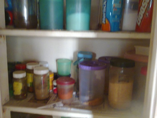 containers of spice powders, salt, pulses, tea, coffee and sugar, etc