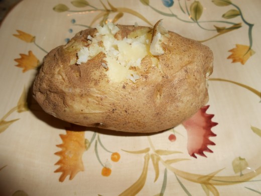 Start with a baked potato, split open the top.