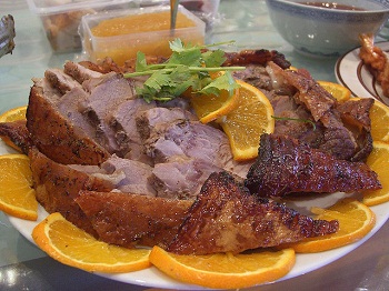 Roast pork with crackling (the skin cooked so it's crisp and delicious). You can see the apple sauce at the top, the traditional accompaniment to roast pork.