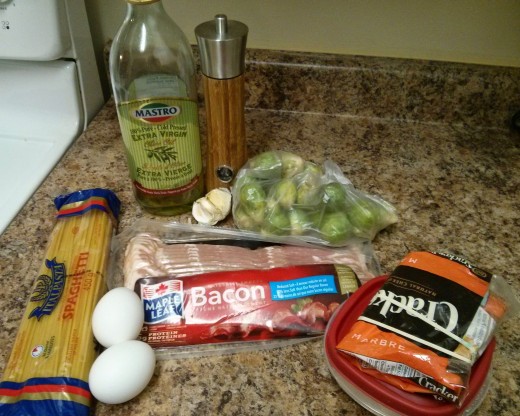 Olive oil, pepper, pasta, eggs, bacon, cheese, garlic, my side of greens (fried brussel sprouts, yum!)