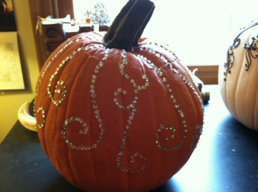 This pretty pumpkin has curlicues of shiny rhinestones down the sides.