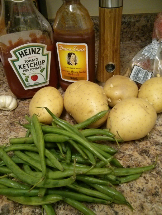 Unfortunately, I forgot to include a photo of the ribs (the most important part!) in this photo, but here we have: ketchup, BBQ sauce, garlic, pepper, brown sugar, beans and potatoes (for sides)