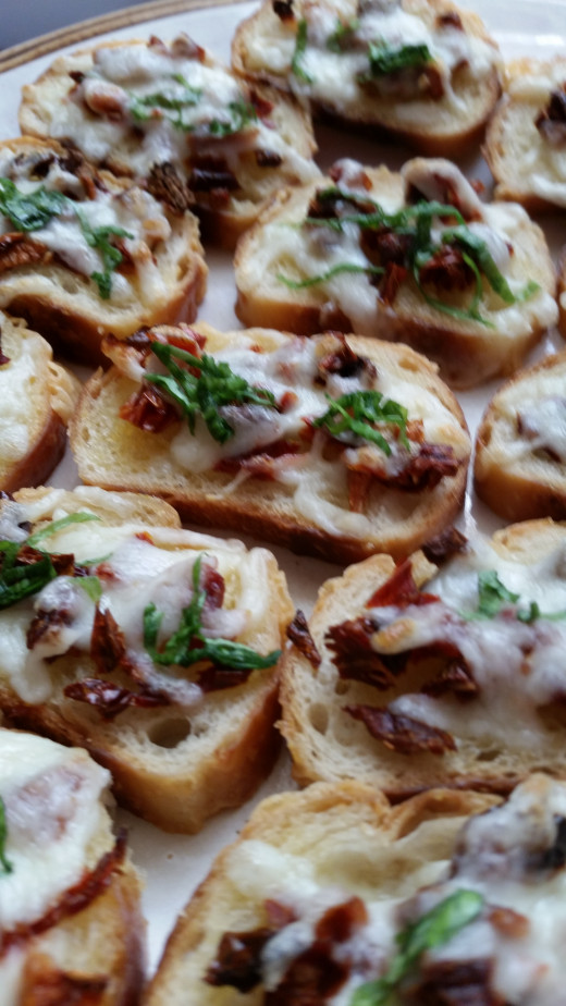 Sun-dried tomato, mozzarella and basil crostinis