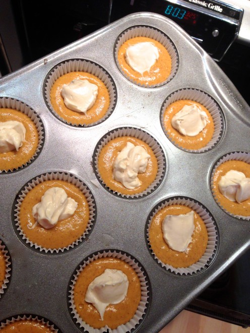 Simply plop the tablespoon of cream cheese mixture on each cup of batter. Simply plop the tablespoon of cream cheese mixture on each cup of batter.