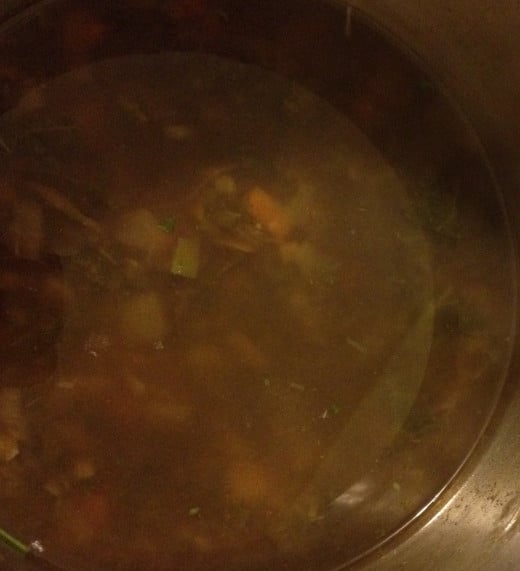 Soup stock simmering in pot
