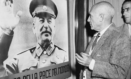 Picasso inspects a picture of Stalin in 1949. Photograph: AFP/Getty Images -/AFP/Getty Images