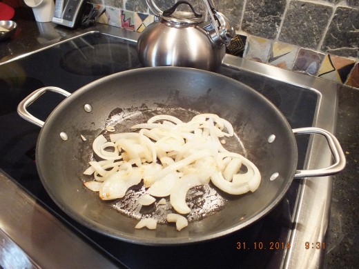 Heat a large sauté pan with a tablespoon of olive oil and add the onion.