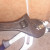 Adjustable spanner loosening gland nut with pipe grips in place to keep the fixture steady. Adjustable spanner loosening gland nut with pipe grips in place to keep the fixture steady.
