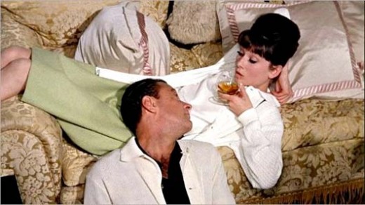 Hepburn with on and off screen love William Holden in Paris When it Sizzles (1964).