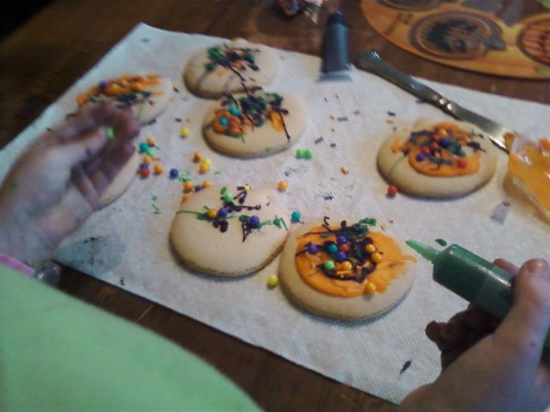 5) Trying not to get your hands too dirty, add the finishing touches to your cookies.
