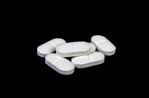 White pills: Check with your doctor before you add aspirin to your daily regimen, especially if you are on other medications.  