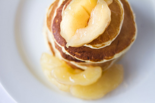 Pancakes made with apple pie filling and topped with cinnamon apples.