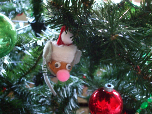 My sons and I made special decorations together for many years, including this walnut shell Santa mouse.