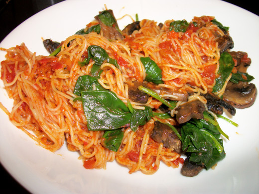 Pasta with sauteed spinach and mushrooms