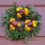 Wreaths made out of natural materials, such as apples and flowers, are beautiful as well as kind on the environment.