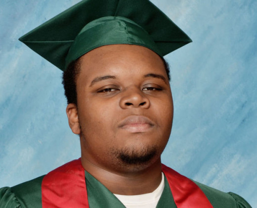 Michael Brown after graduating high school with plans to go to college a week before being shot to death.