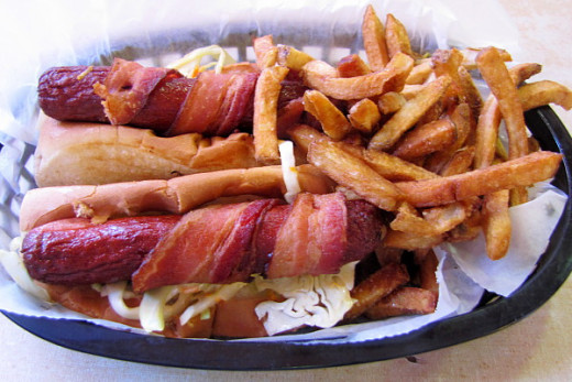 Here we have deep fried bacon wrapped hotdogs. If you use good quality hot dog wieners and wrap your hot dogs with bacon they will be delicious. 