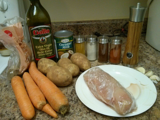 Oil, Carrots, Brown Sugar, Potatoes, Chicken, Coconut Milk, Curry Powder, Cayenne Pepper, Chili Powder, Garlic Salt, Garlic Cloves, Black Pepper, Basil