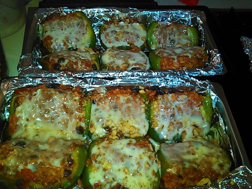 Stuffed green peppers - halved to serve. Cook hot sausage with ground beef. Add raisins, tomato soup, diced tomatoes, rice.  Bake until pepper softens.  Top with walnuts and pepper jack cheese.