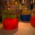 Jolly Rancher Vodka: Local stores sell rather inexpensive jars that are easy to clean and use again.  We stored some jars in the freezer for a year and it still tasted amazing.  Very easy to make.