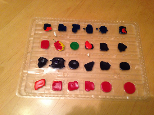 Let wax cool in the molds. (Notice one or two multi-colored shapes in there.)