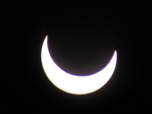 Solar Eclipse: 6:54 PM - The sun puts on a happy face