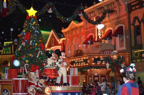 Mickey Mouse and Minnie Mouse waves to fans at Walt Disney World's Magic Kingdom during "Mickey's Very Merry Christmas Party" held from November through December.