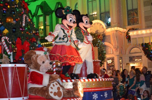 The host and his girlfriend welcome guests to "Mickey's Very Merry Christmas Party" at The Magic Kingdom at Walt Disney World.