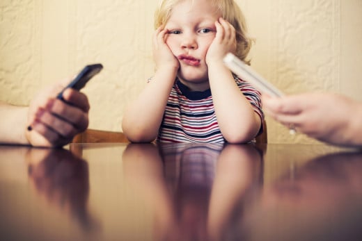 A new study from Boston Medical Center reveals that parents who get absorbed by email, games or other apps have more negative interactions with their children.