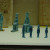 Small statues made of a glass like substance called faience. Small figures representing servants to serve in the afterlife or gods to protect in the afterlife, were placed in tombs. Small statues made of a glass like substance called faience. Small figures representing servants to serve in the afterlife or gods to protect in the afterlife, were placed in tombs.