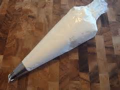 Wrapped parchment paper to tube filling into cannoli