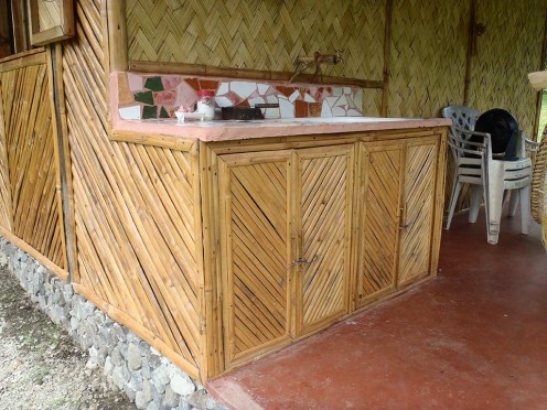 This was the first bamboo project. A sink stand and cupboard that attached to the bamboo pump house and shower room. I used recycled broken tiles for the top of the sink stand.