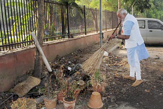 Modi cleaning roadside dust for Swachh Bharat Abhiyan