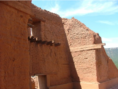 A side of wall of the mission ruins shows modern attempts to secure, yet return the original structure to some authenticity.