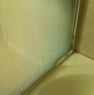 Alkali and soap build up crusted over a year before purchase of the home.