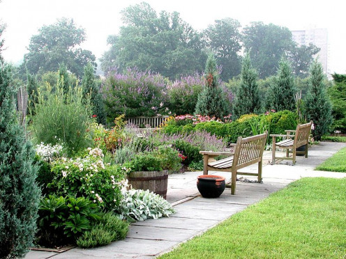 I would love to sit on that bench in that herb garden.  It is so beautiful! 