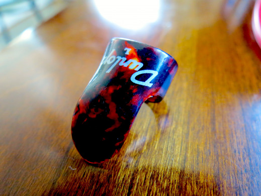A Dunlop finger pick. 