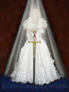 The bride is holding her sword! Which translates into the Word of God covering her life.