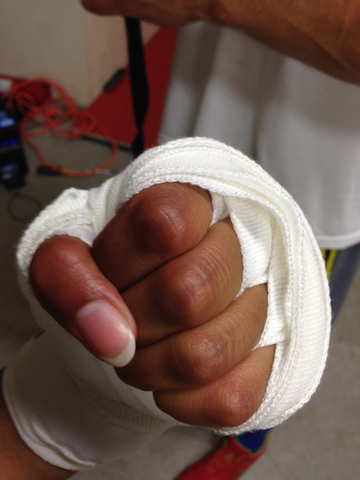 A novice shows off her recently wrapped hand. Now she's ready for action!
