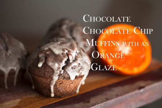 Dark chocolate muffins with chocolate chips and orange glaze.