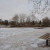 In this original photograph, I wanted the frozen lake to command a large portion of the frame, but to add interest I let the tree line break up the upper third of the image and walked around until I placed the empty bench in the bottom right third.