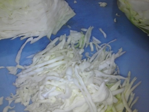 Figure 1-3. Finely shred the cabbage. Cuts should create pieces about the thickness of a dime. (I struggle with this one myself. But the fermentation process is forgiving.)