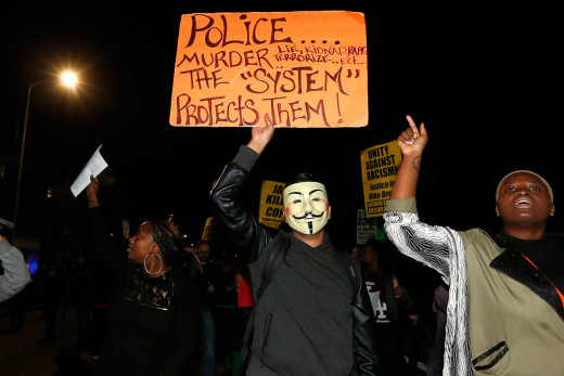 Protestors in L.A. repeat the message in a demonstration in Los Angeles following the grand jury's refusal to indict Officer Wilson in the shooting of Michael Brown.